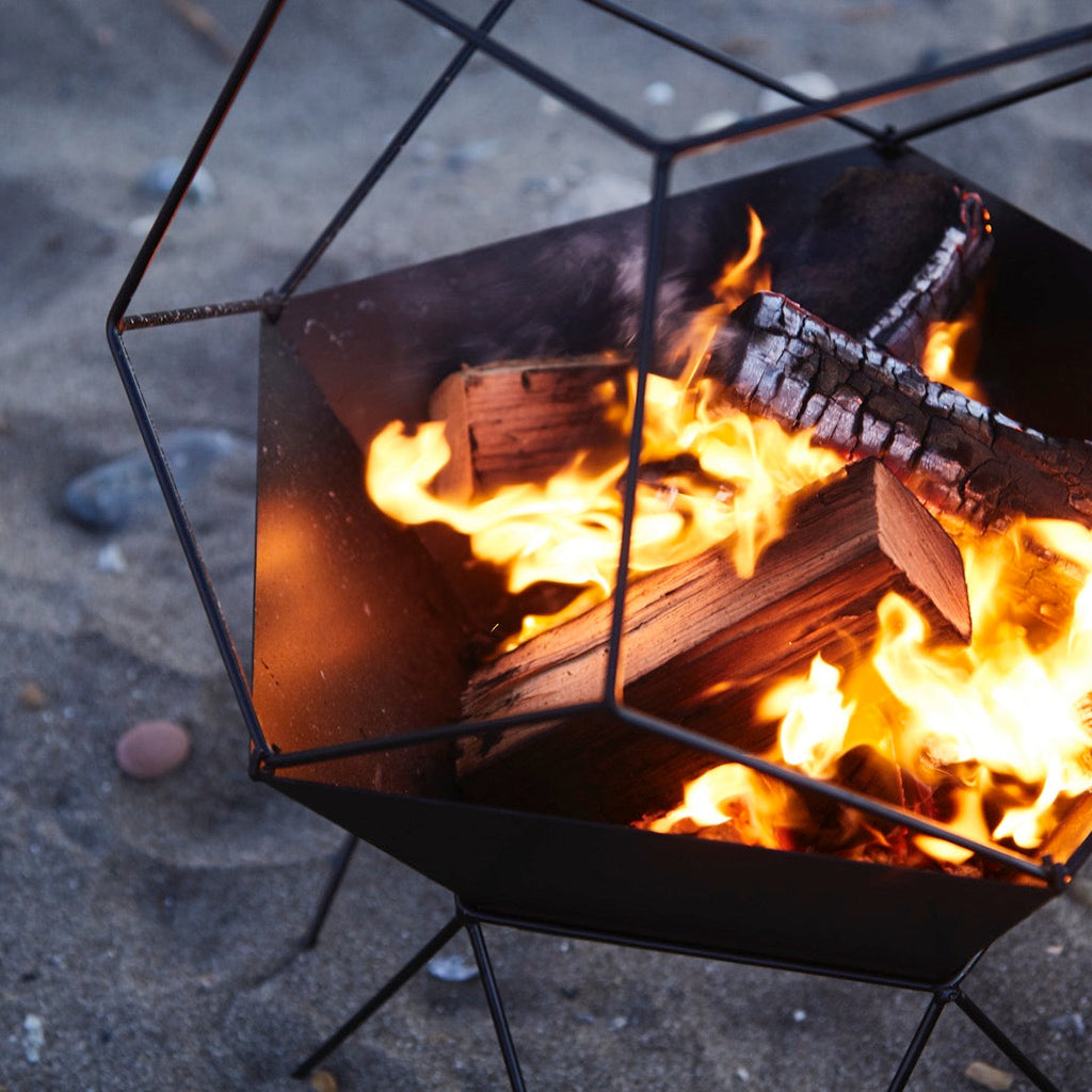 How do you safely light a fire basket?
